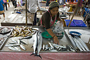 A woman selling fish on a local market in Ao Nang, Krabi Province, Tha...