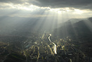 The Sun is breaking through dark clouds over Sarajevo in this aerial s...