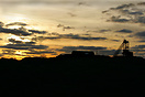Sunset view of the now disused large wheel at Mynydd Parys Copper mine...