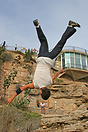 Some local teens, jumping from a large rock on to the beach in Nerja.