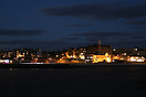 View of the town of St Andrews at night from the beach.