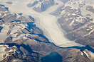 Aerial picture of a glacier and mountains over Greenland