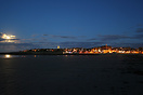 View of St Andrews at night from the beach.