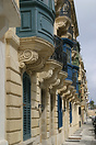 A terrace of houses facing Valletta harbour