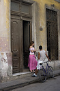 A couple of young lovers by the door