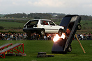 Car stunt rider, flying through the air at Mona showground, Anglesey.