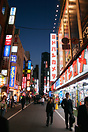 Shinjuku streets at night lit up with neon lighting