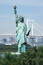 A replica Statue of Liberty, Tokyo Tower in the background along with ...