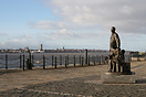 A statue depicting emigrants on the dockside in Liverpool overlooking ...