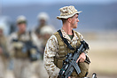 A soldier of the United States Marine Corps takes up point duty