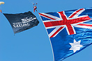 Parachutist displaying the Australian Flag and the City of Geelong Fla...
