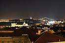 A night view over part of Lisbon and the River Tagus. The Bridge and C...