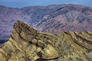 The classic view of Zabriskie Point taken just after sunrise. The moun...