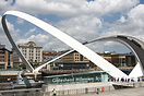 The Gateshead Millennium Bridge tilting upwards to allow HMS Example, ...