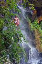 Young Mauritian boy cooling off at one of the many of the islands wate...