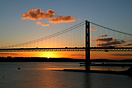 A Winter Sun sets behind the Forth Road Bridge, North Queensferry, Fif...