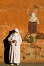 A woman beside the Marrakech walls
