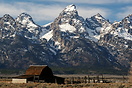 A traditional wooden barn is overlooked by Grand Teton, a full 7500ft ...