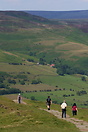 Hikers above the Vale of Edale in England's Peak District National Par...