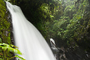 One big and one little waterfall sharing the same river.