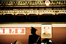 Guard in front of the Tienanmen Gate to the Forbidden City. Mao pictur...
