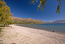Lake Wanaka in late summer before the Autumn leaves and snow on the mo...