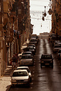 A typical hill side street in Valletta. Note the shiny surface of the ...