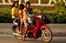Taken at sunset during the local rush hour - this young mother negotia...