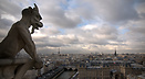 Gargoyles of Notre Dame Cathedral and a view across Paris