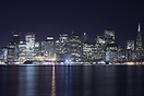 The lights San Francisco by night reflected in San Francisco Bay