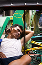 Tricycle driver sleeping in his vehicle, Manila