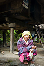 Old woman in front of her house in the village of Tam-an, near Banaue.
