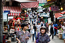 Elderly women in a Soho street market, Hong Kong